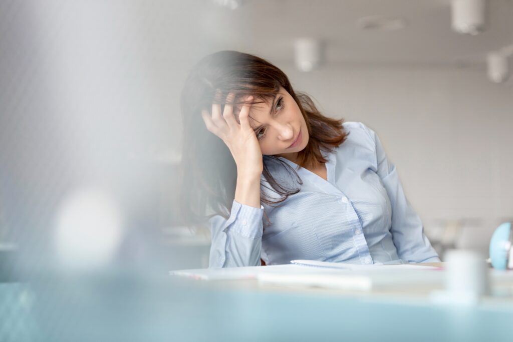 Stressed woman worried about credit report errors and debt collections
